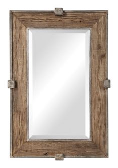 a wooden frame mirror hanging on the wall