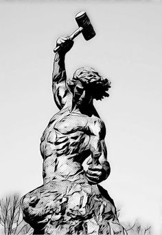 black and white photograph of a statue with a hammer in it's right hand