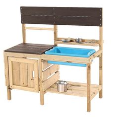 a child's wooden play kitchen with blue sink and potty pan on it