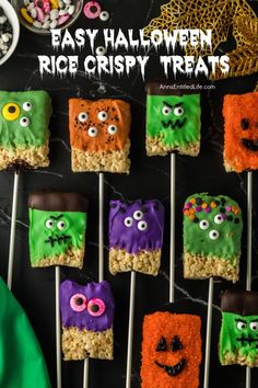 halloween rice krispy treats are on sticks with eyes and mouthballs in the middle