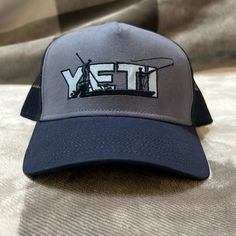 Never Worn, Yeti Adjustable Trucker Hat. Blue Baseball Cap For Winter Outdoor Activities, Casual Short Brim Trucker Hat For Fishing, Blue Cap For Outdoor Activities, Winter Outdoor Blue Baseball Cap, Casual Fishing Trucker Hat With Flat Brim, Blue Winter Baseball Cap For Outdoor, Casual Flat Brim Trucker Hat For Fishing, Casual Gray Fishing Hat, Gray Casual Fishing Hat