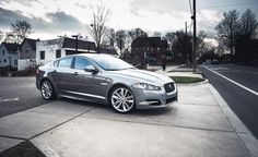 a silver car parked on the side of a road