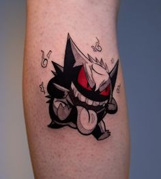 a cartoon character tattoo on the leg