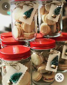 several jars filled with cookies and christmas decorations