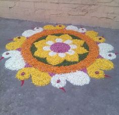 an image of a flower design on the ground