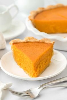 a slice of pumpkin pie on a white plate