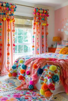 a bedroom decorated in bright colors with pom poms on the bed and curtains