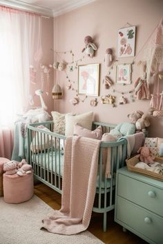 a baby's room is decorated in pastel colors