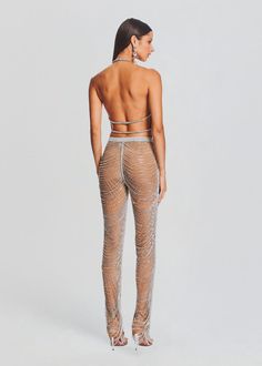 the back view of a woman wearing sheer mesh leggings