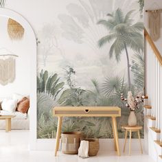 a living room scene with focus on the table and palm trees painted on the wall