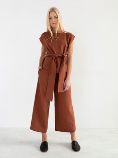 "ALEXANDRA is a linen tie waist top. DETAILS - Cap sleeve design - Crew neck - Self tie belt - 100% lightweight European linen fabric - Cut and sewn to order just for you in our studio COLOR - Rust, you can also choose other colors above - Fabric samples are available here https://www.etsy.com/listing/586569696/linen-fabric-samples SIZING & FIT - Relaxed, loose fit - Length (shoulder to hem) is approximately 22.5 inches / 57 cm - Bust (pit to pit) is approximately 20.5 inches / 52 cm - Shoul Brown Linen Blouse For Work, Casual Wrap Blouse With Tie Waist, Casual Belted Tops For Work, Brown Linen Blouse For Spring, Spring Brown Linen Blouse, Summer Workwear Belted Blouse, Casual Spring Belted Blouse, Linen Wedding Dress, Tie Waist Top