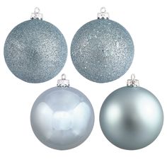 three blue and silver ornaments hanging from strings