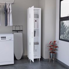 a washer and dryer sitting next to each other in a room