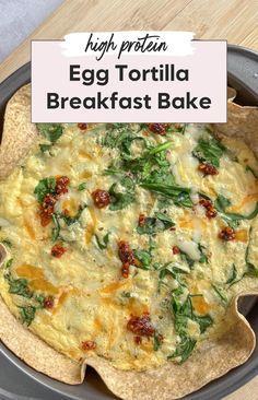 egg tortilla breakfast bake in a pan with spinach and cheese on top