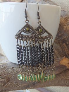 Chandelier green earrings. Green dangle earrings. Bohemian Fringes earrings. Crystal dangle chain earrings. Boho fringe earrings These green chandelier earrings are comfortable and unique, that will fit many styles and will be a perfect boho style gift for women. Metal: Brass, Oxidized Silver Gemstone: Length: 6 cm (2.36 inches) Width: 2.5 cm (0.98 inches) The earrings will be packed in a gift box. FOR MY EARRINGS COLLECTION HERE: https://www.etsy.com/il-en/shop/rebekajewelry?section_id=14222612 Wire Wrapped Chandelier Earrings For Festivals, Elegant Festival Chandelier Earrings With Tassels, Elegant Tassel Chandelier Earrings For Festivals, Bohemian Metal Tassel Earrings For Pierced Ears, Bohemian Earrings With Dangling Charms, Handmade Metal Bohemian Tassel Earrings, Metal Tassel Jewelry As Gift, Bohemian Metal Dangle Tassel Earrings, Bohemian Metal Tassel Dangle Earrings