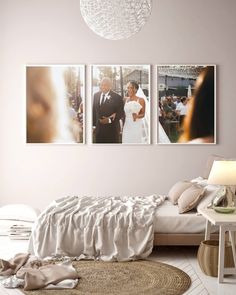 a bedroom with two pictures hanging on the wall and a bed in front of it