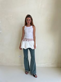 The Balloon Skirt is an ultra voluminous mini skirt featuring an elastic waistband, flat lining, and lightweight cotton poplin fabrication. Layers Skirt Outfit, Mini Skirt Over Jeans, Pants And Skirt Outfit, Summer Outfits Layering, Mini Skirt Over Pants, Balloon Skirt Outfit 2024, Skirt Layering Outfit