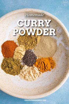 homemade curry powder in a white bowl with the words homemade curry powder on it and spices