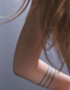 a woman's arm with two lines on it