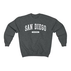 "\"San Diego, California\" College Crewneck Sweatshirt --- - This soft sweatshirt has a loose fit for a comfortable feel - Durable print - Loose fit - 50% Cotton; 50% Polyester (fibre content may vary for different colors) - Runs true to size --- Thanks for visiting our store! --- Shipped from our partner in the US --- You can find even more sweatshirts here: https://www.etsy.com/shop/lukassfr" College Crewneck Sweatshirts, Brooklyn Girl, Attractive Clothing, University Style, Washington Usa, Nurse Sweatshirt, Style Sweatshirt, College Sweatshirt, College Design