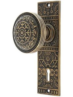 an ornate door knob with a decorative design on it