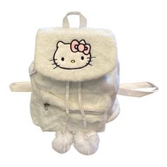 This New Adorable Backpack Features The A Hello Kitty Character . It Is Made Of Soft White Fuzzy Plush Material And Has Pom-Poms And Hello Kitty Embroidered Accent On The Front . The Bag Has A Magnetic Closure And Adjustable Straps For A Comfortable Fit. It Also Has An Outer Pocket For Added Convenience. The Backpack Measures 10.2 X 5.5 X 9.8 Inches And Is Perfect For Kids Who Love Hello Kitty. Hello Kitty Backpack, Kitty Backpack, Hello Kitty Characters, Plush Backpack, Cute Backpacks, Medium Bags, Soft White, Pom Poms, Magnetic Closure