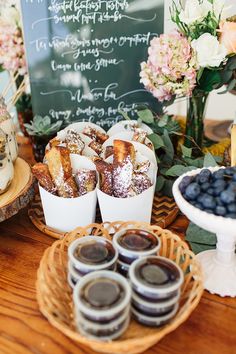 desserts and pastries displayed on wicker baskets with flowers in the back ground