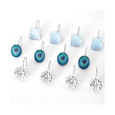 six pairs of earrings with blue and white designs on them, all in different shapes