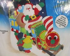 a christmas decoration kit with santa claus and other holiday decorations on it's package