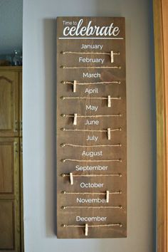 a wooden calendar hanging on the wall