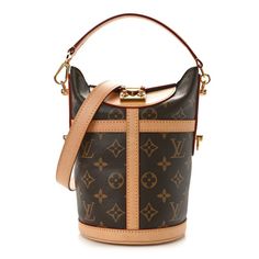 This is an authentic LOUIS VUITTON Monogram Duffle Bag. This stylish bag is crafted of coated canvas. It features a top press lock, vachetta trimmed details, polished brass hardware, a short top handle strap and an optional vachetta shoulder strap. This opens to reveal to a black microfiber interior with a patch pocket. Louis Vuitton Duffle, Louis Vuitton Duffle Bag, Monogrammed Duffle Bag, Stylish Bag, Trim Detail, Brass Hardware, Polished Brass, Authentic Louis Vuitton, Short Tops