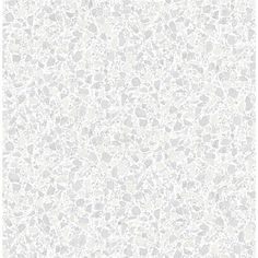 a white and gray wallpaper with small rocks on the surface, as well as a pattern