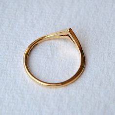 "Crafted in 14k solid gold, this ring features 2 V shaped chevrons, stacked onto each other but together. This handcrafted ring will enhance the beauty of your engagement ring multi fold :) * Gold - 14k, 1.6 gms yellow gold (approx) If you like this ring, please press \"Pin it\" button on the right of your screen. Find us on Instagram for exquisite designs: @abhikajewels Like us on Facebook: www.facebook.com/Abhikajewels Thank you for visiting our shop.. :) <3" Dainty Gold Rings With Tension Setting, Minimalist Open Band With Tension Setting, Dainty Gold Stackable Rings With Tension Setting, Teardrop Sterling Silver Rings In Gold, Gold Teardrop Sterling Silver Rings, Minimalist Gold Stackable Rings With Tension Setting, Minimalist 14k Gold Teardrop Ring, Simple Gold Solitaire Jewelry, Minimalist 14k Gold Wedding Ring With Tension Setting