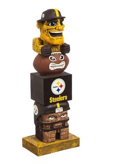 a wooden totem with two footballs on it's head and the words pittsburgh