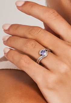 a woman's hand with a ring on it