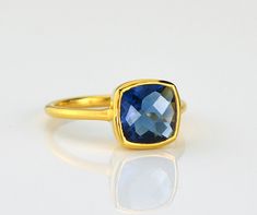 This beautiful stackable bezel set ring is made with cushion shape faceted natural Blue Kyanite quartz gemstone in 18K Vermeil Gold. The ring has a 925 stamp. Gemstone size is 10 mm. Please specify your size at checkout.  Since I use natural gemstones, the stones may vary slightly in September Birthstone Ring, Blue Gemstone Ring, Kyanite Ring, September Birthstone Rings, Blue Gemstone Rings, Gold Vermeil Jewelry, Cushion Ring, Jewelry Blue