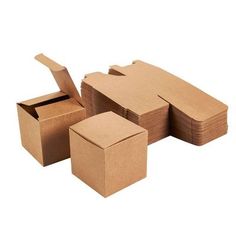 several cardboard boxes stacked on top of each other with one open box in the middle