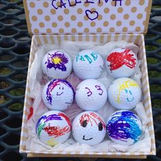 a bunch of balls that are sitting in a box on the computer screen with writing on them