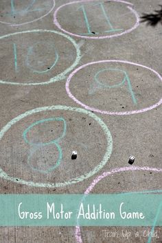 a sidewalk with chalk writing on it that says gross motor addition game