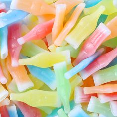 there are many different colored candy sticks together