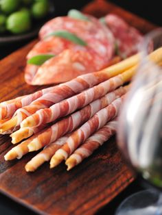 several different types of meats on a cutting board