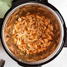 shredded chicken in an instant pot on the stove