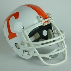 an orange and white football helmet is shown