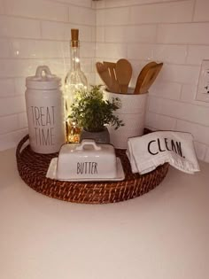 a kitchen counter with utensils and bottles on it