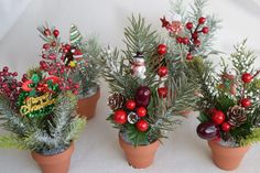 small potted plants decorated with christmas decorations