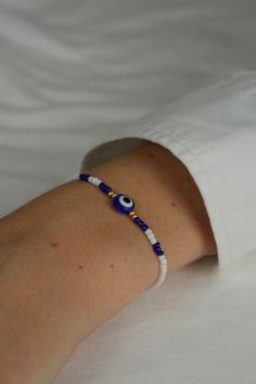 🧿beautiful bracelet 🧿golden highlights 🧿elastic 🧿freely selectable length 🧿perfect for giving as a gift 🧿each bracelet individually 🧿 If you have any questions, please write to me :) I look forward to your order and to making you happy Cheap Blue Evil Eye Friendship Bracelets, Evil Eye Bracelet Beaded, Cute Blue Bracelet Ideas, Beaded Evil Eye Bracelet, Evil Eye Seed Bead Bracelet, Hand-strung White Jewelry As A Gift, Hand-strung White Jewelry For Gift, White Hand-strung Jewelry For Gifts, Elegant Blue Friendship Bracelets With Colorful Beads