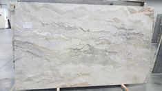 a large marble slab sitting on top of a pallet in a room next to other materials