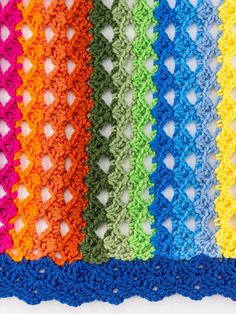 crocheted squares are lined up in different colors