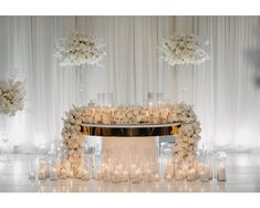 a table with candles and flowers on it