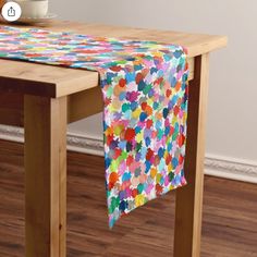 a colorful table runner with hearts on it